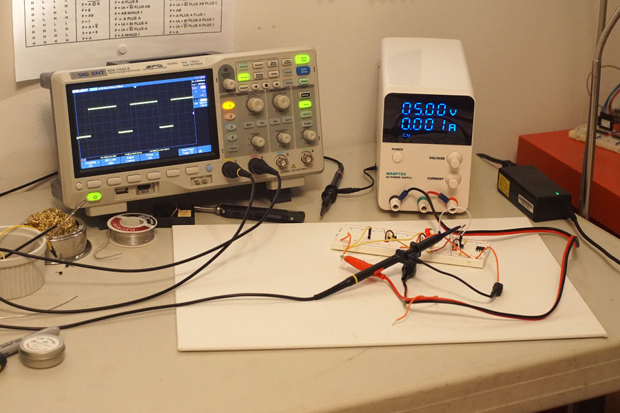Siglent 1104X-E Oscilloscope, Wanptek Power Supply, and a clock prototype